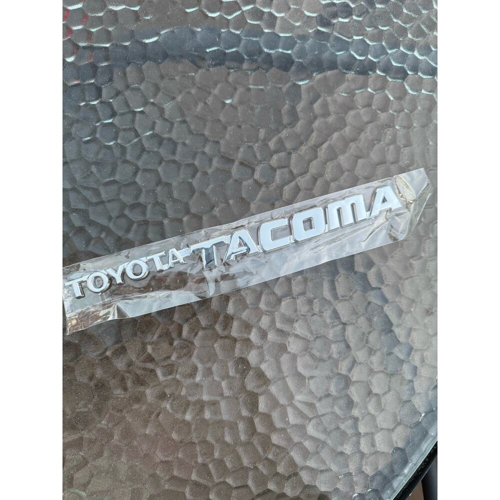 Toyota Tacoma Silver Chrome Plastic Emblem Sticker, new.